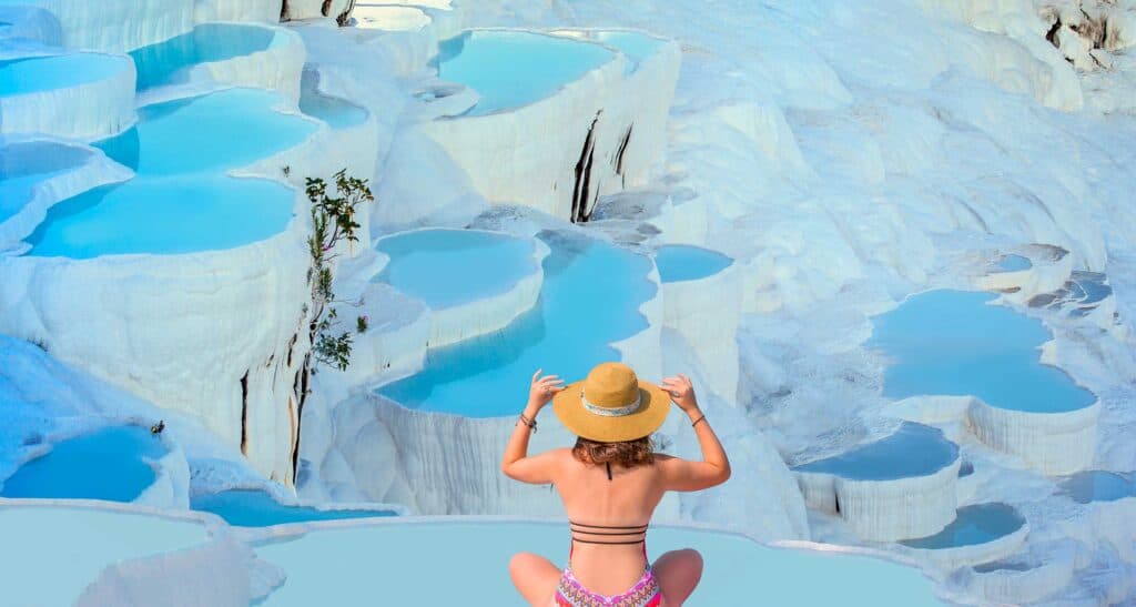 She is watching the view in Pamukkale Thermal Pool